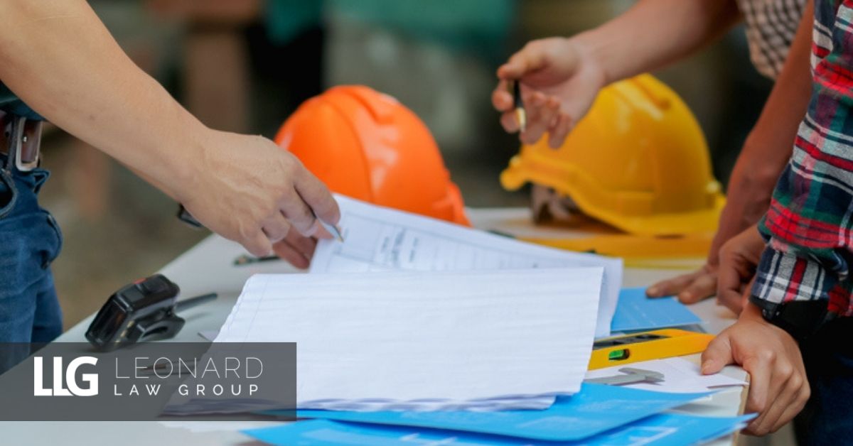 construction site engineer with hard hat on table