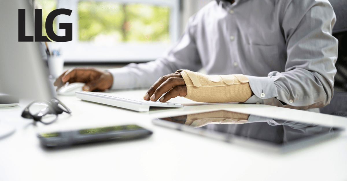 Person working on a laptop (grayscale image)